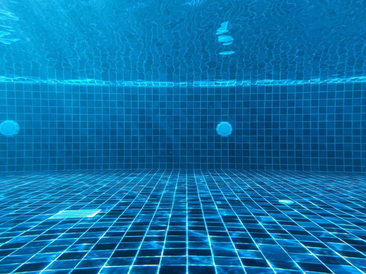 blue swimming pool with water